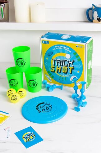 لعبة Fizz Creations Trick Shot The Game. يتضمن كل ما تحتاجه لممارسة اللقطة المثالية! تتضمن أكواب التراص، وكرات بينج بونج، وسهام لاصقة، وقرص رمي، وبطاقات التحدي. العاب الحدائق العاب الحفلات in Kuwait
