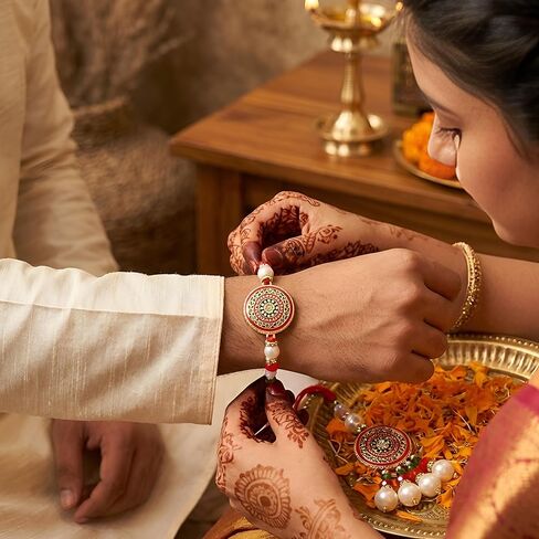 TIED RIBBONS Rakhi for Brother and Bhabhi | Rakhi Set for Bhai Bhabhi Rakhi | Mini Greeting Card | Roli Tikka - Raksha bandhan | Lumba Rakhi for Bhabhi Rakhi for Bhaiya Bhabhi with Gift in Saudi Arabia