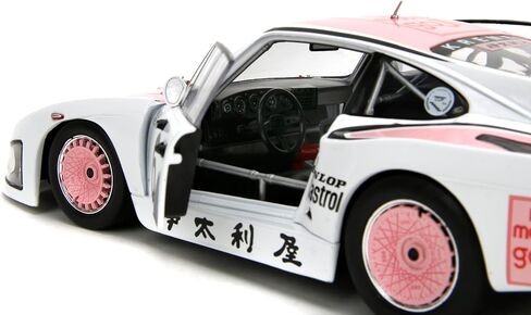 Jada Pink Slips 1981 Porsche 935 K3-1:18 نموذج Diecast مع أبواب مفتوحة وتوجيه عمل - لهواة الجمع والمتحمسين 14+ - أبيض ووردي in Kuwait