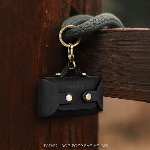موزع أكياس براز الكلاب مصنوع يدويًا من الجلد - أنيق ومتين مع حزام مرفق لمشاية الكلاب، ويتميز بمشبك معدني نحاسي باللون الأسود الفحمي in Kuwait