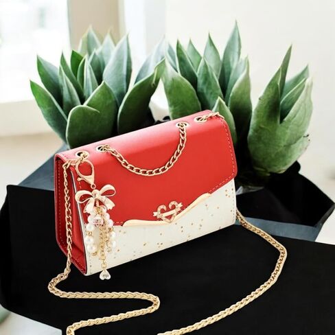 Women's Crossbody Satchel Handbag with Gold Chain Strap, Bow and Pearl Charm decoration. in Saudi Arabia