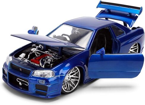 Jada Toys Fast & Furious 1:24 إصدار الذكرى السنوية 1999 Nissan Skyline GT-R (BNR34) سيارة مصبوبة - لمسة نهائية معدنية زرقاء مع غطاء رأس مفتوح وأبواب وصندوق السيارة in Kuwait