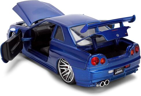 Jada Toys Fast & Furious 1:24 إصدار الذكرى السنوية 1999 Nissan Skyline GT-R (BNR34) سيارة مصبوبة - لمسة نهائية معدنية زرقاء مع غطاء رأس مفتوح وأبواب وصندوق السيارة in Kuwait