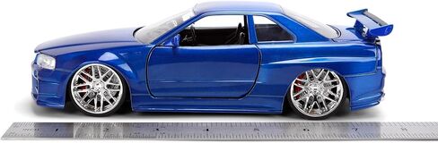 Jada Toys Fast & Furious 1:24 إصدار الذكرى السنوية 1999 Nissan Skyline GT-R (BNR34) سيارة مصبوبة - لمسة نهائية معدنية زرقاء مع غطاء رأس مفتوح وأبواب وصندوق السيارة in Kuwait