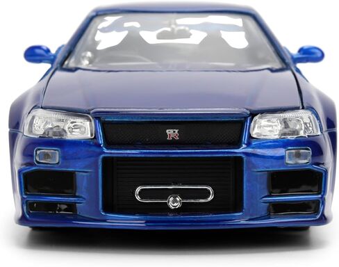 Jada Toys Fast & Furious 1:24 إصدار الذكرى السنوية 1999 Nissan Skyline GT-R (BNR34) سيارة مصبوبة - لمسة نهائية معدنية زرقاء مع غطاء رأس مفتوح وأبواب وصندوق السيارة in Kuwait