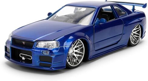 Jada Toys Fast & Furious 1:24 إصدار الذكرى السنوية 1999 Nissan Skyline GT-R (BNR34) سيارة مصبوبة - لمسة نهائية معدنية زرقاء مع غطاء رأس مفتوح وأبواب وصندوق السيارة in Kuwait