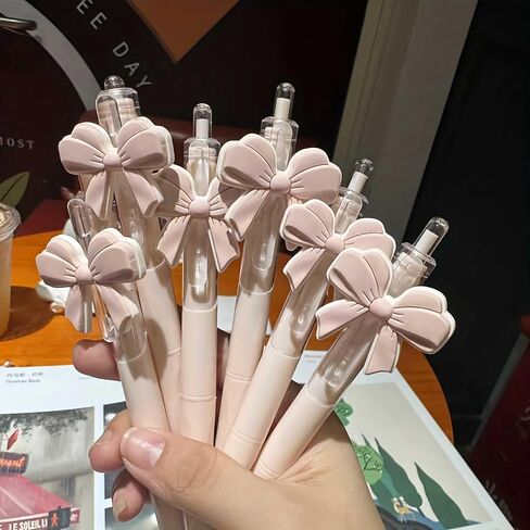cute pink ballpoint bow pens for girls, aesthetic kawaii retractable pens sets for gift, soft grip pen office smooth writing school supplies, coquette party favors stuff for desk accessories (10 pcs ) in Saudi Arabia