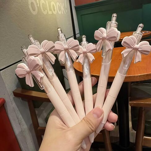 cute pink ballpoint bow pens for girls, aesthetic kawaii retractable pens sets for gift, soft grip pen office smooth writing school supplies, coquette party favors stuff for desk accessories (10 pcs ) in Saudi Arabia
