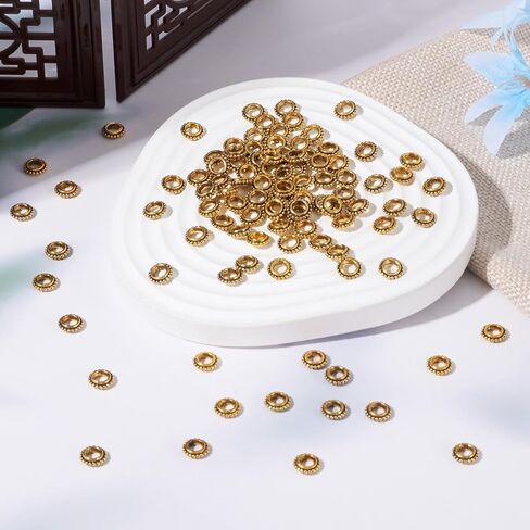 KISSITTY 100 قطعة من الخرز الفواصل على شكل كعكة ذهبية عتيقة على الطراز التبتي بفتحة كبيرة معدنية فضفاضة 8 × 2.5 مم مع فتحة 4 مم لصنع المجوهرات العتيقة بنفسك in Kuwait