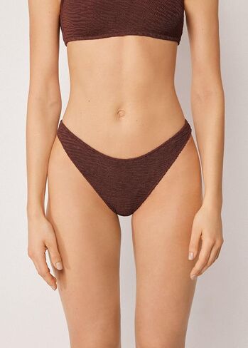 Woman's Brazilian Swimsuit Bottoms Crinkle Waves in Saudi Arabia
