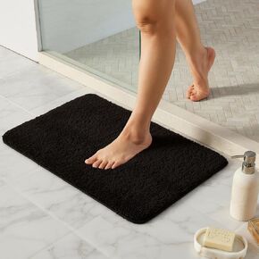 TYUU Black Bathroom Rug, Ultra Soft Bath Rugs Non Slip Washable, Super Absorbent Quick Dry Small Bath Mat with Rubber Backing for Bathroom Floor, Shower, or Sink, Black 16" x 24" in Saudi Arabia