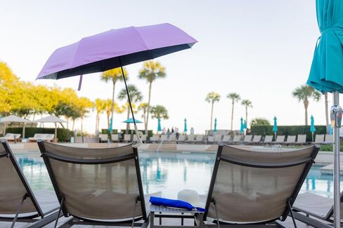 Clamp on Chair Umbrella, folds to just 16", overhead-bin friendly, carry-on sized, meets standard carry-on regulations, easy to travel sun shade umbrella that can be used for beach, resort, cruise, or camping. Frees hands for reading and relaxation. in Kuwait