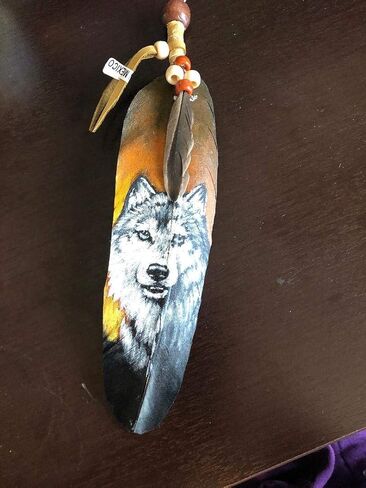 Wolf Hand Painting on a Large Feather by Jose Carmelo Canales in Saudi Arabia