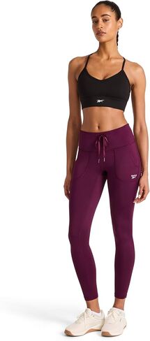 سروال نسائي من Reebok Momentum Brushback، مقاس قياسي، درزة داخلية 28 بوصة، قماش جيرسي بوليستر خفيف الوزن ومطاط in Kuwait
