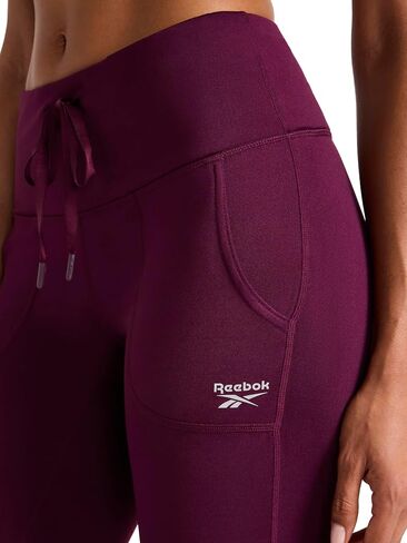 سروال نسائي من Reebok Momentum Brushback، مقاس قياسي، درزة داخلية 28 بوصة، قماش جيرسي بوليستر خفيف الوزن ومطاط in Kuwait