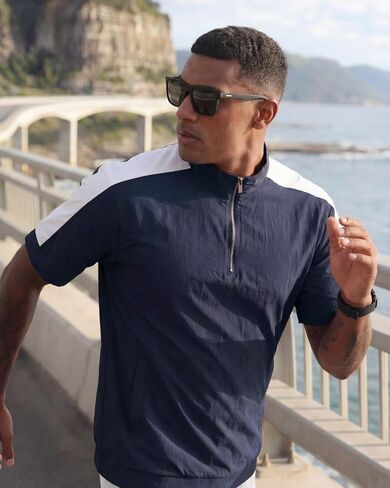 Opomelo Mens Cage Jacket Weather-Resistant Windbreaker Lightweight Short Sleeve Waterproof Golf Polo Raider Pullover with Pocket for Workout Navy XL in Saudi Arabia