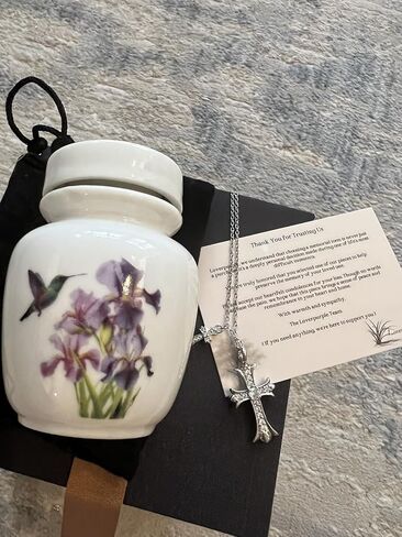Mini Cremation Urn with Hummingbird and Iris Flower Design, White Ceramic Memorial Keepsake with Cross Necklace in Saudi Arabia