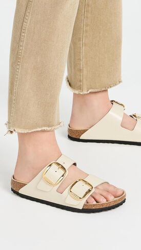 صنادل Arizona Big Buckle High Shine للسيدات من Birkenstock، إكرو، 7-7.5 ضيق أمريكي in Kuwait