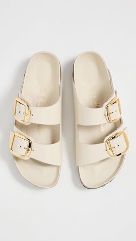 صنادل Arizona Big Buckle High Shine للسيدات من Birkenstock، إكرو، 7-7.5 ضيق أمريكي in Kuwait