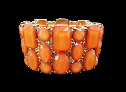 Beautiful wide orange stretch bracelet for women with a mix of bead shapes in oval, round, and rectangle and all in gold prong settings. Bold Wide Statement Bracelet – Trendy Colorful Fashion Jewelry in Kuwait