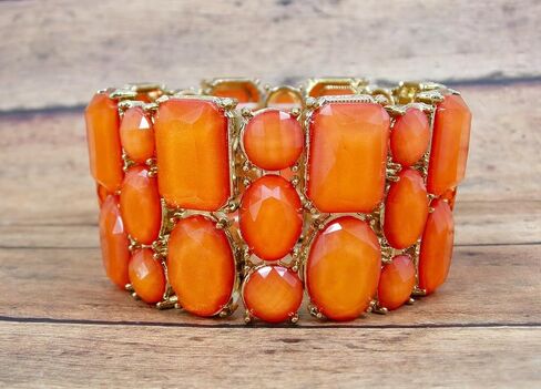Beautiful wide orange stretch bracelet for women with a mix of bead shapes in oval, round, and rectangle and all in gold prong settings. Bold Wide Statement Bracelet – Trendy Colorful Fashion Jewelry in Kuwait
