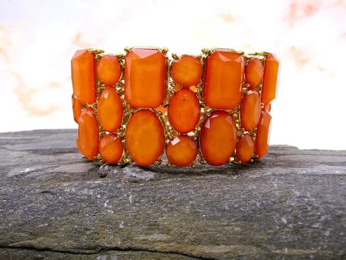 Beautiful wide orange stretch bracelet for women with a mix of bead shapes in oval, round, and rectangle and all in gold prong settings. Bold Wide Statement Bracelet – Trendy Colorful Fashion Jewelry in Kuwait