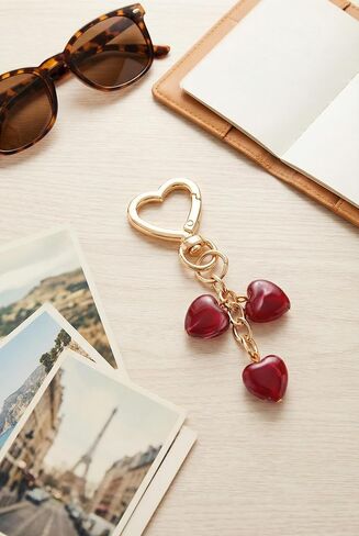 Triple Red Heart Bag Charm Elegant Jewelry Style Resin Purse Charm with Polished Gold in Saudi Arabia