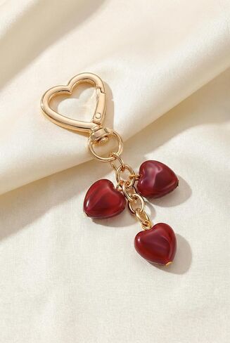 Triple Red Heart Bag Charm Elegant Jewelry Style Resin Purse Charm with Polished Gold in Saudi Arabia
