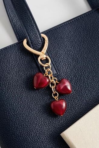Triple Red Heart Bag Charm Elegant Jewelry Style Resin Purse Charm with Polished Gold in Saudi Arabia