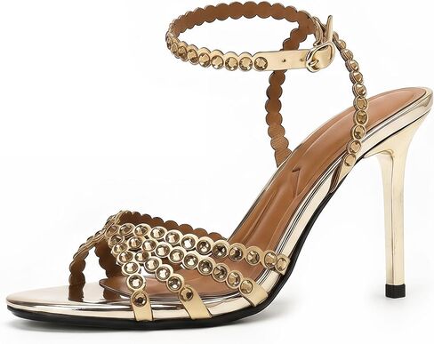 On feet& in love Metallic strappy high-heeled sandals with unique rhinestone embellishments on the ankle strap and an open-toe design, perfect for an elegant party look in Saudi Arabia