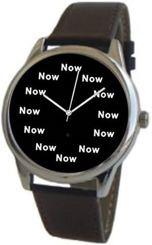 Now Is The Time That Is Shown Each Hour on The Black Dial of The Extra Large Polished Chrome Watch with a Black Leather Strap in Saudi Arabia