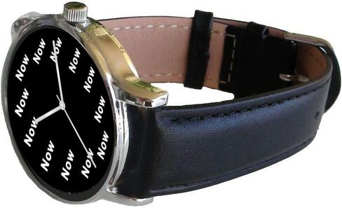 Now Is The Time That Is Shown Each Hour on The Black Dial of The Extra Large Polished Chrome Watch with a Black Leather Strap in Saudi Arabia