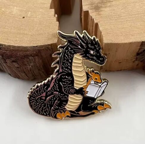 Dragon Reading Book Enamel Pin, Black and Gold Fantasy Lapel Pin, 4cm x 3.77cm, 1.5 inches in Saudi Arabia