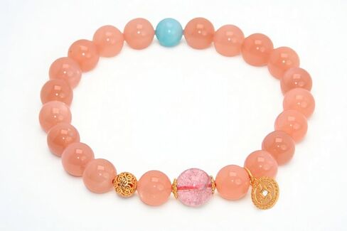 Peach Pink Beaded Bracelet with Turquoise Accent & Gold Coin Charm in Saudi Arabia