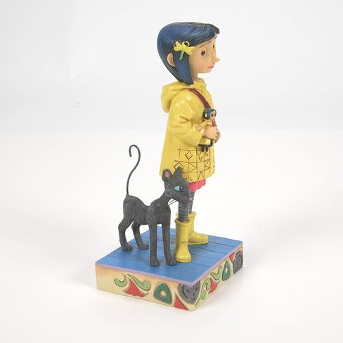Enesco Coraline by Jim Shore Wearing Yellow Raincoat Figurine, 6.34 Inch, Multicolor in Kuwait