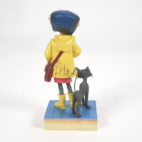 Enesco Coraline by Jim Shore Wearing Yellow Raincoat Figurine, 6.34 Inch, Multicolor in Kuwait