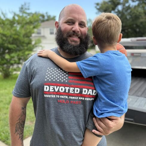 Devoted Dad to Faith Family Freedom Dark Heather Grey Cotton Men's T-Shirt in Saudi Arabia