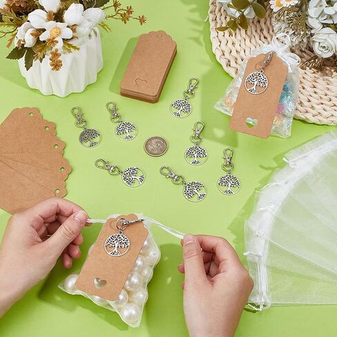 PH PandaHall 48 Sets Tree of Life Keychain Favors Party Favor Silver Tree Keyring with Organza Gift Bags Celebration of Life Favors Small Mesh Bag with Tags for Christmas Wedding Baptism Guest Return in Saudi Arabia