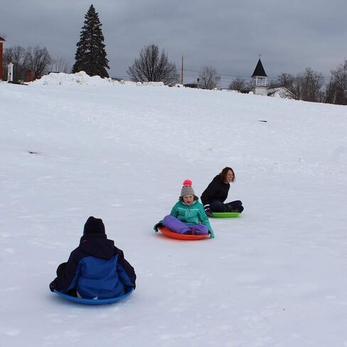 Flexible Flyer Flying Saucer 26 Inch Round Plastic Sled Snow Toy, 1 Person Winter Sled w/Hand Grips for Kids and Adults, Ages 4 Years and Up, Orange in Kuwait