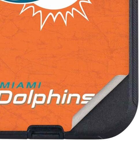 غلاف هاتف Skinit متوافق مع OtterBox Defender iPhone 15 - مرخص رسميًا من NFL Miami Dolphins Distressed - تصميم برتقالي in Kuwait