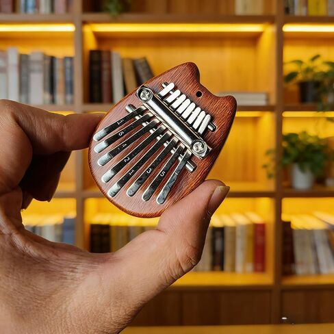 8 مفاتيح Sapele Water Drop Thumb Piano، بيانو صغير مع حبل، بيانو صغير محمول، هدايا مثالية لمحبي الموسيقى والمبتدئين in Kuwait