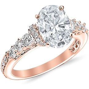 1.55 Carat Designer Four Prong Round Diamond Engagement Ring with a 0.7 Carat Oval Cut E Color VS2 Clarity Center Stone