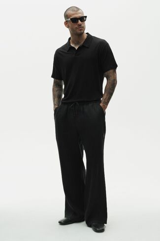 Alo Yoga Linen Jersey Coastal Short Sleeve Polo - Black in Saudi Arabia