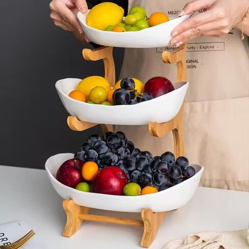 D'CENT EVERYDAY LUXURY - وعاء فواكه من السيراميك مكون من 3 طبقات مع حامل من خشب الخيزران لطاولة المطبخ، وسلة فواكه من البورسلين لتخزين الخضروات، ورف أطباق صينية كعكة الحلوى والوجبات الخفيفة لحفلات الزفاف - أبيض in Kuwait
