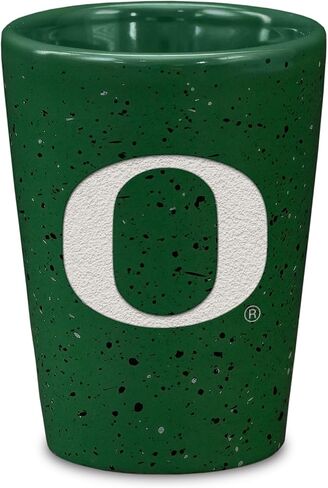 Rico Industries NCAA Oregon Ducks Standard 2oz Ceramic Shot Glass for Fans, Laser Engraved In Team Color Single Shot Glass in Kuwait