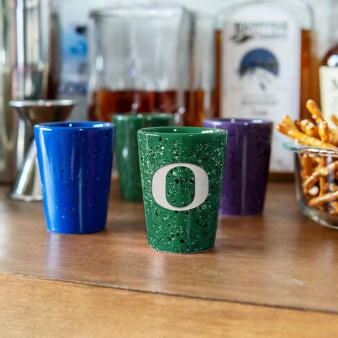 Rico Industries NCAA Oregon Ducks Standard 2oz Ceramic Shot Glass for Fans, Laser Engraved In Team Color Single Shot Glass in Kuwait