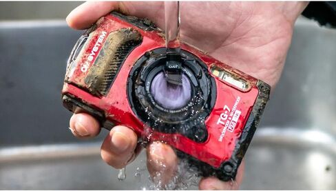 OM Systems Tough TG‑7 12MP 4K Underwater Digital Camera (Red) Adventure Bundle with Lexar 64GB SDXC Card + Deco Essentials Sling Backpack in Kuwait