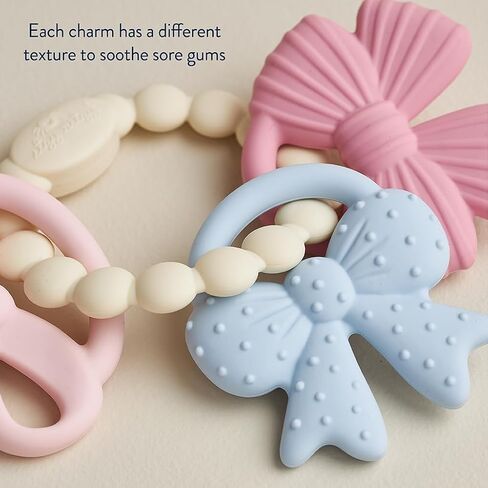 Itzy Ritzy Silicone Teether Trio for Babies - Soft, Flexible BPA-Free Teething Toys with Textured Surfaces & Easy-Grip Ring for Sensory Play and Fine Motor Skill Development (Bows) in Kuwait