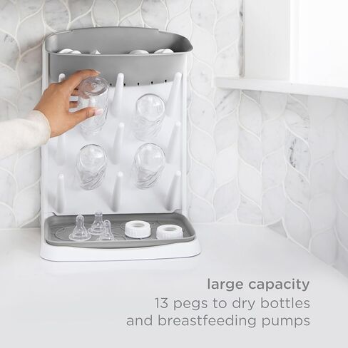 Ubbi Vertical Baby Bottle Drying Rack, Space Saving Countertop Bottle Dryer | 13-Peg Bottle Drying Rack Removable Drain Tray, Baby Organizer for Pump Parts, Pacifiers & Accessories, Dishwasher Safe, Gray in Kuwait