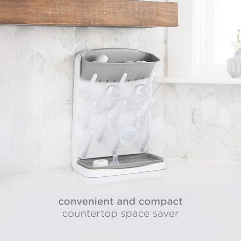 Ubbi Vertical Baby Bottle Drying Rack, Space Saving Countertop Bottle Dryer | 13-Peg Bottle Drying Rack Removable Drain Tray, Baby Organizer for Pump Parts, Pacifiers & Accessories, Dishwasher Safe, Gray in Kuwait